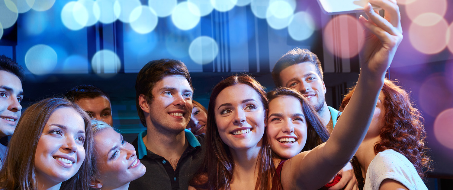 Friends smiling together for a selfie