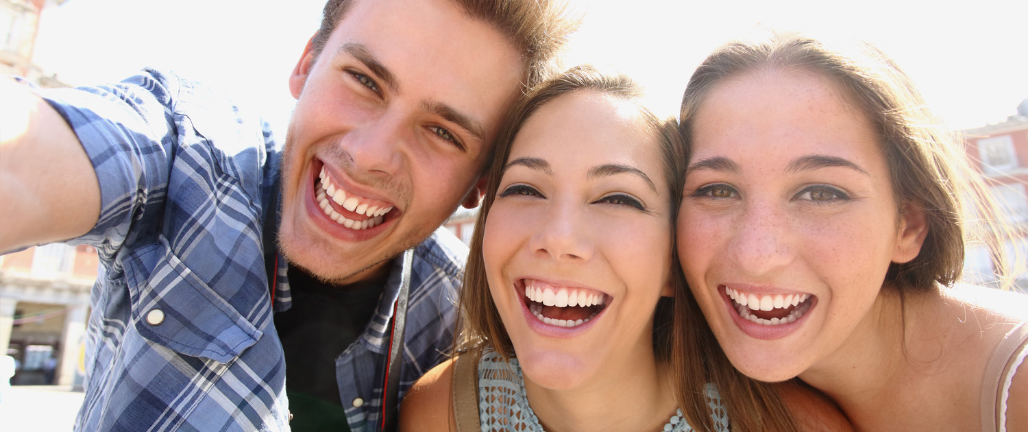Three friends smiling together